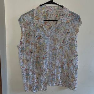 White floral blouse with lace detailing near buttons